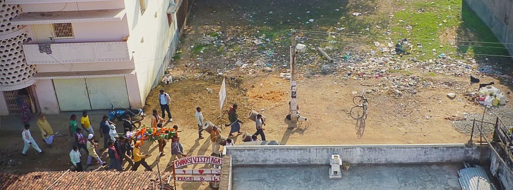 carrying the dead past the rubbish